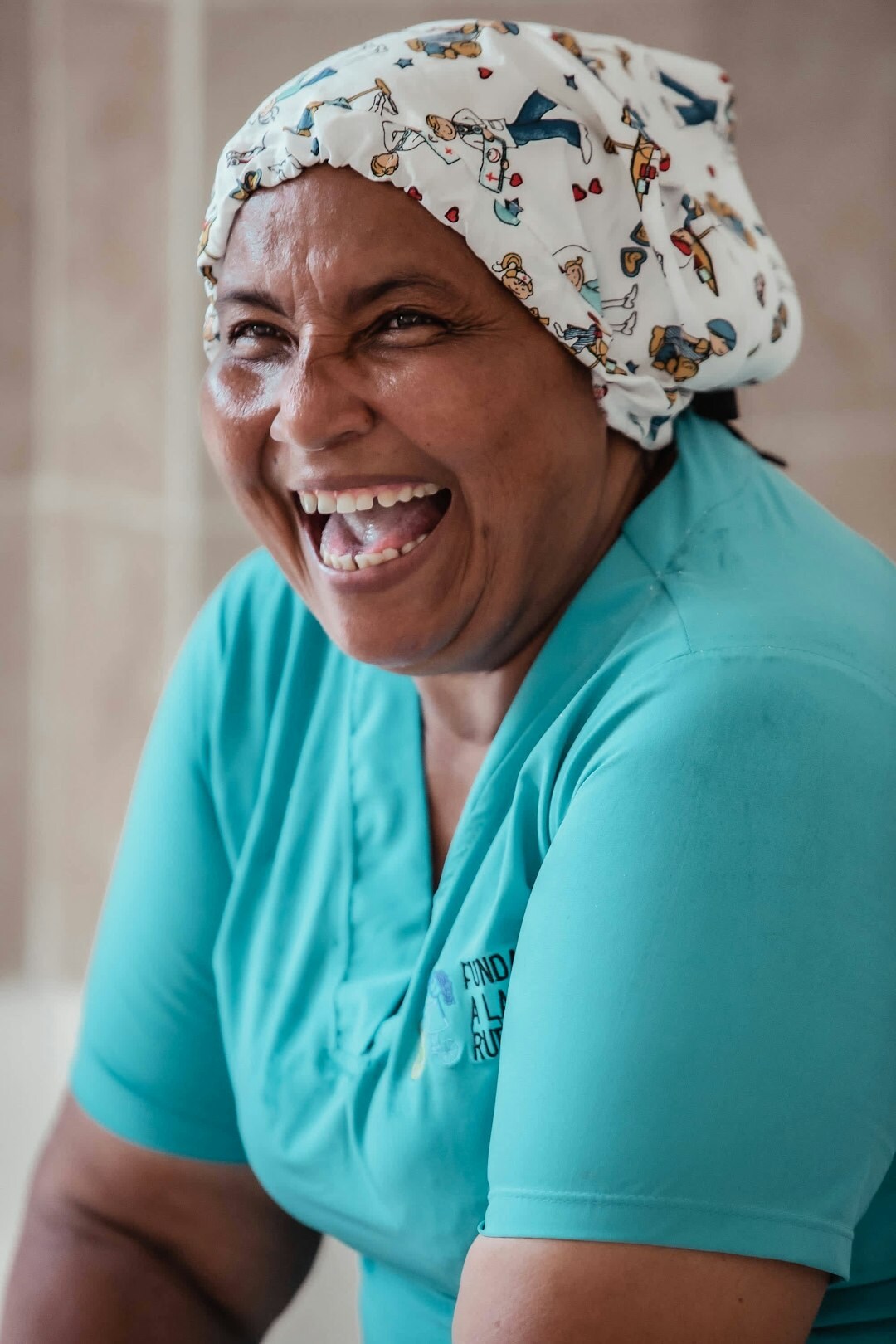 Friendly older woman staff member smiling