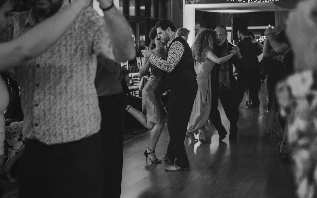 Senior citizens dancing together in a community hall