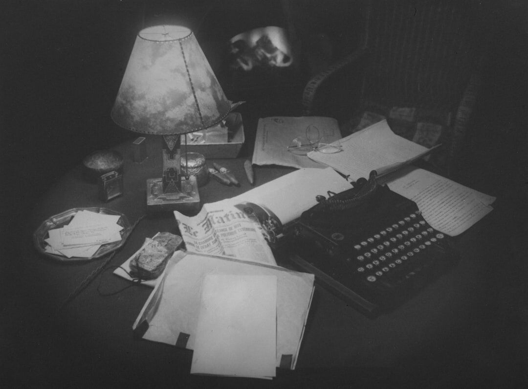 author writing mystery novel at desk
